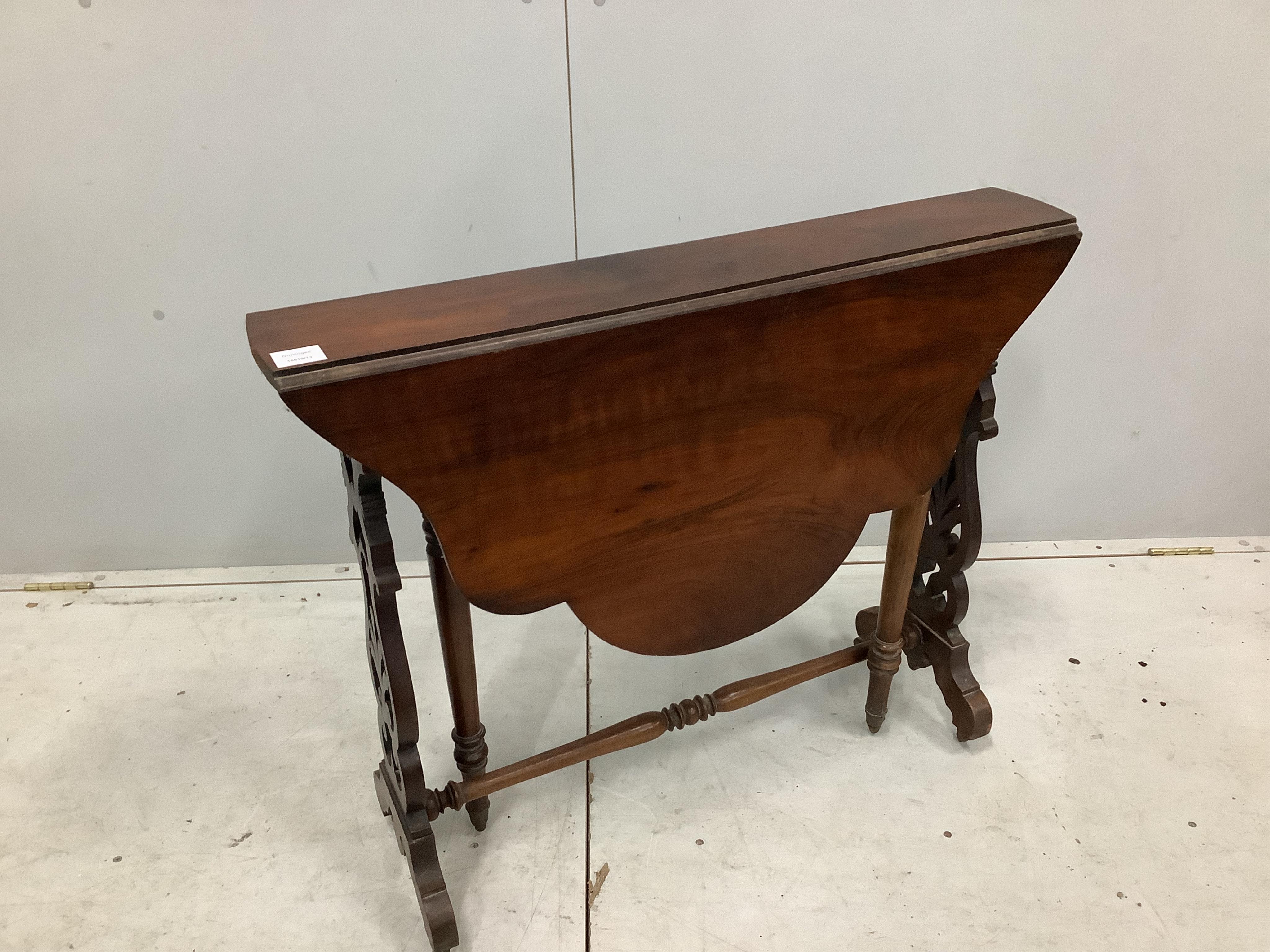 A Victorian walnut Sutherland table with shaped oval top, width 88cm, depth 16cm, height 72cm. Condition - fair